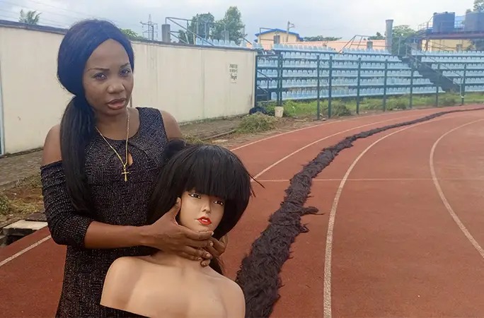 Nigerian woman sets new Guinness World Record for longest handmade wig